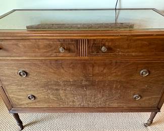 This is a unique vintage dresser with a modern top. 