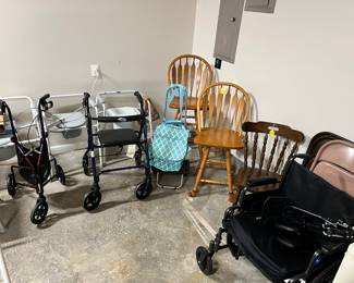Wheelchair, 2 walkers, 3 potty chairs, 3 metal folding chairs, 2 wooden swivel barstools, and one wooden chair. 