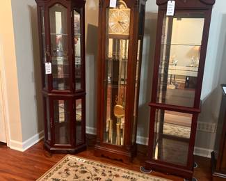 Howard Miller Grandfather Clock. Corner Curio & a small Curio Cabinet (both with working lights). 