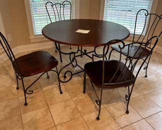 glass top table wrought iron bace with 4 matching chairs