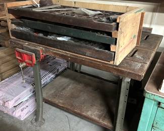 A very old homemade storage drawer made out of old military (?) desk drawers.  Below is an old table saw OLD table saw...non working but a great base for a table!  