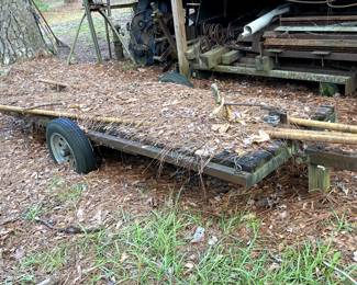 Another homemade trailer - with some more scrap metal/iron in the background.