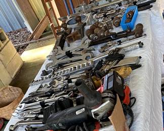 Bundles of wrenches, drills, antique beds, old doors.  And More.