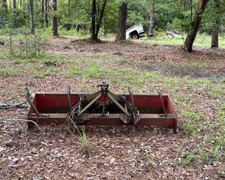 Box blade and note another handmade truck bed trailer in the background.