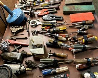 Bundles of Screwdrivers, clamps, socket sets, more pipe wrenches, chucks....