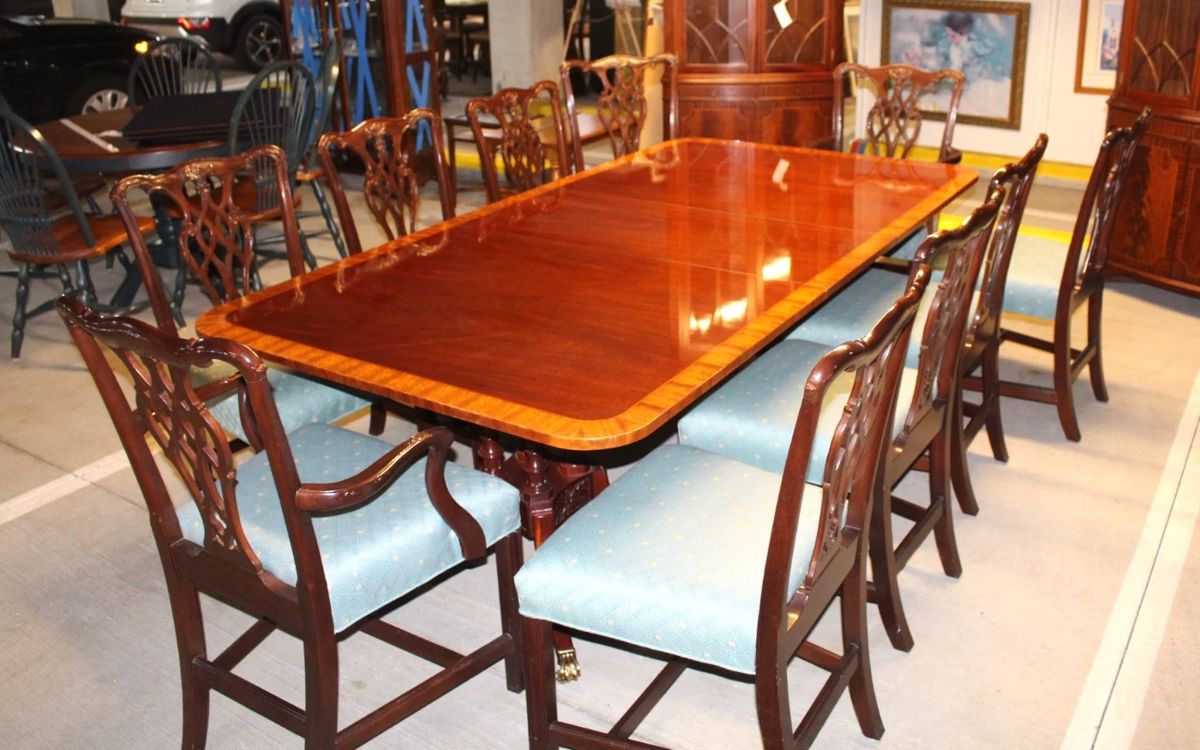 Baker dining table with two support bases. Two captains' arm chairs, plus EIGHT side dining chairs. Table and TEN chairs are being sold together.