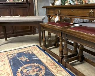 Console with stools that tuck under it.  Needlepoint bench and very nice Chinese runner.