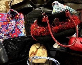 Large amount of purses, including Vera Bradley, Couch and more.