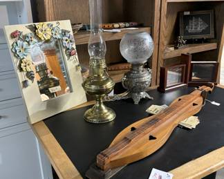 Lots of bookcases, desks, lamps and mirrors.  Dulcimer.