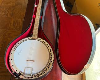 This is a Contessa 5-string banjo and case.