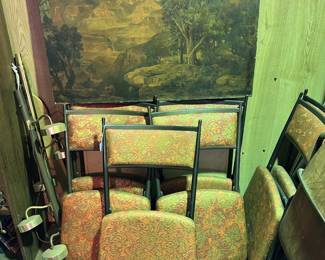 There is a set of folding chairs (at least seven), as well as the picture of a canyon (Grand Canyon?)