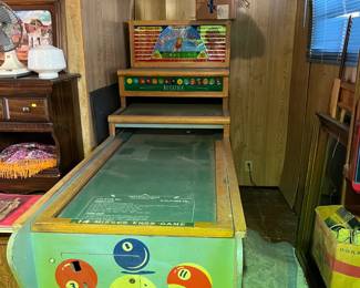 This is an unusual item. It is a billiards-style arcade game, though we're unsure how to play it.