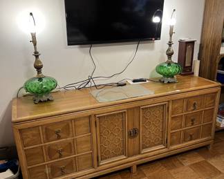 These matching desk lamps need lampshades, but bring a definite style to your decor. Or come take a look at the buffet hutch on which they rest. The TV is also up for sale.