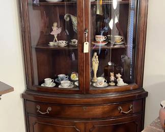 This corner display cabinet would look great in your living room.