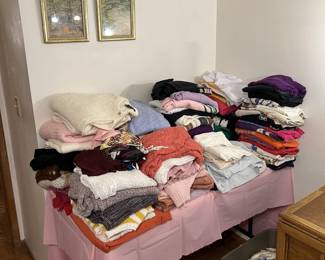 Did you think there wasn't clothes in the sale? Well, here are a number of the available pieces. There are also a pair of framed artworks on the wall.