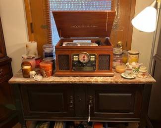 Yes, the label says Victrola, but it has an LP record player and a CD player, so it is decent quality and adds an air of vintage.