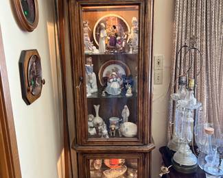 There are several figurines in this smaller lighted display cabinet.  
