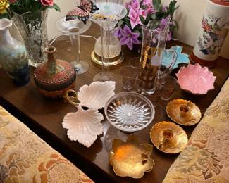 Between the sofa and the loveseat are these candleholders and small candy dishes.