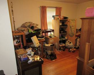 Bedroom set - turntable inside cabinet in foreground, plenty of shoes, scarves.
