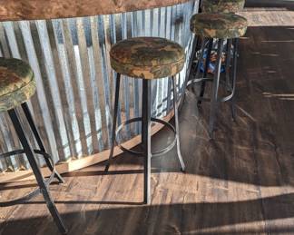 7 bar stools available. Sturdy.
