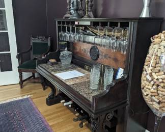 Wine bar crafted from an antique piano. Lighted and power outlets at the back corners of the counter.