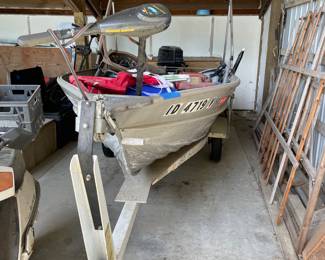 Lot #206  Fishing boat with all contents and trolling motor