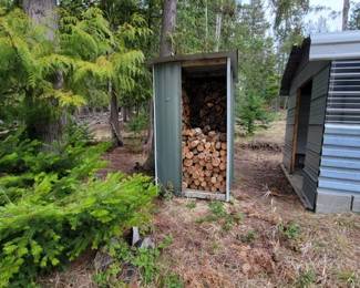 Firewood including shed.  You must disassemble and remove shed Lot #174