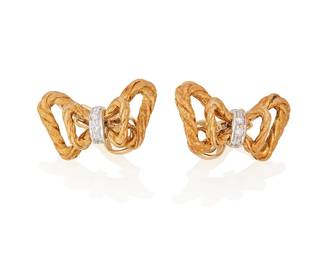 7
A Pair Of Buccellati Earrings
Of rope-twist desiged bows, accented by 8 round brilliant-cut diamonds weighing approximately 0.08 carat, set in 18K yellow gold, signed Buccellati

13.94 grams gross
2 pieces
0.5" H by 0.75" W
Estimate: $500 - $700