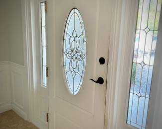 All doors, trim, moldings, wainscoting, and windows in house