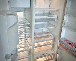 GE Monogram black side by side refrigerator with ice dispenser