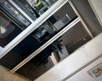 GE Monogram black side by side refrigerator with ice dispenser