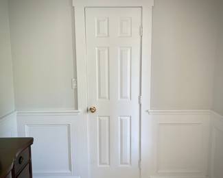 All doors, trim, moldings, wainscoting, and windows in house