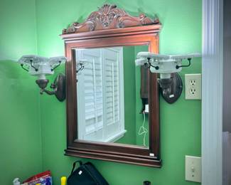 All bathroom light fixtures, mirrors, vanities, toilets, and medicine cabinets