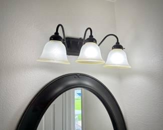 All bathroom light fixtures, mirrors, vanities, toilets, and medicine cabinets
