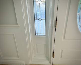 All doors, trim, moldings, wainscoting, and windows in house