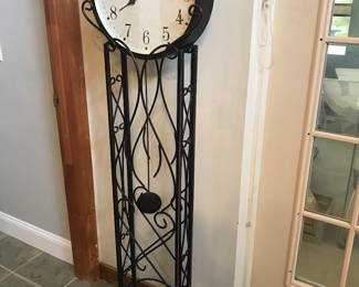 large open metal floor clock