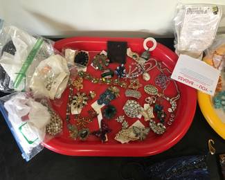 collection of antique and vintage pins and jewelry