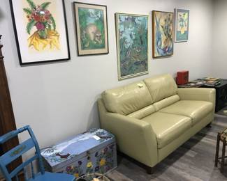 Natuzzi leather couch, painted cedar blanket chest, framed art