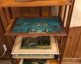 wood shelf, framed artwork, cigar maker