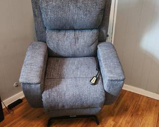 Motorize  Left/recliner chair,  adjustable headrest, With remote control.  Great condition 