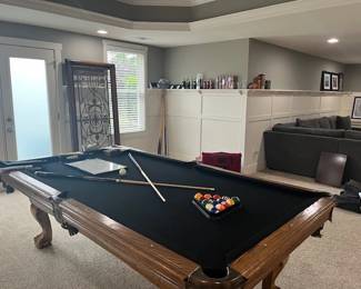 Pool table, wall decor, Porsche and Coca Cola memorabilia         