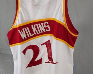 Lot 102: Autographed Atlanta Hawks Dominique Wilkins jersey in size XL with JSA certification card
