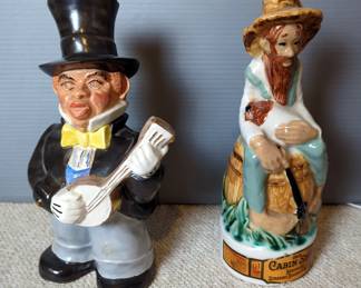 Ceramic 11" Banjo Player Decanter, And 12" Old Cabin Still Decanter
