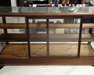 H. Pauk & Sons Mfg Co St Louis Antique General Store Retail Display Case With Carved Front Trim, Wood Framed Glass Doors, And Lift Out 2-Piece Glass Top, 36" x 72" x 25"