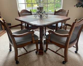 $375 Dining/kitchen table w/4 chairs on casters