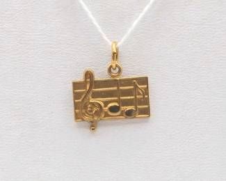 #772 • 14K Gold Musical Staff & Notes Pendant, 2.63g
