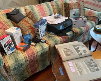 JFK newspaper clippings , jump start box, lively couch, echo dot?HP printer ,canon photo selphy cp1200 printer , cannon digital camera 