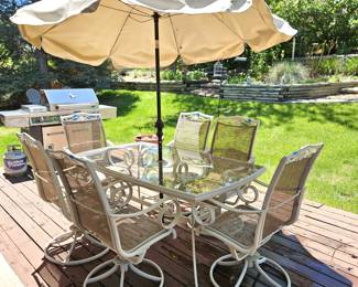 Patio Table, Chairs and umbrella.  Note: Chairs show a lot of wear on seat fabric.  Chairs will be sold separately