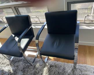 $120 pr. Black faux leather and chrome side chairs (as found - some wear on the back) 22.5”w X 23”d X 32.5”h.