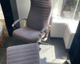 $840 One of two BoConcept reclinable chair and ottoman. Grey fabric and brushed metal detail. Chair is 25”w X 22”d X 41”h. Ottoman is sloped and measures 19.5”w X 19.5”d X 16.5”h at the back and 13.5” at the front.
